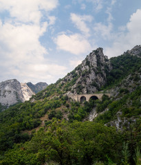 View of approach to the marble quarries in the Apuan Alps mountains, near Carrara, Italy. Famous for white marble, but also popular with tourists.