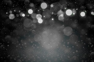 Fototapeta na wymiar cute shining glitter lights defocused bokeh abstract background with falling snow flakes fly, festival mockup texture with blank space for your content