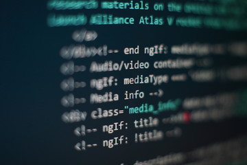 Programmer workplace. Big data storage and cloud computing representation. Programming code. Website development. Web site codes on computer monitor. Abstract screen of software. Computer script.