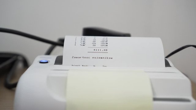 Thermal printer printing results of counting coins by automatic coin counter.