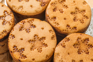 closeup view christmas mini cakes on wooden board