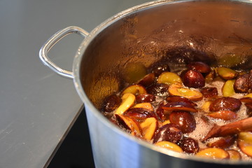  saucepan with  plum jam preparation