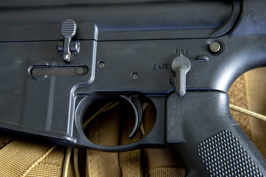 close up of m4 carbine, black rifle, assault rifle. Details of commands of safe and hold open