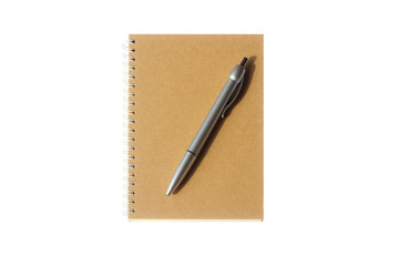 Naklejka premium Brow notebook with pen on the top isolate on white background
