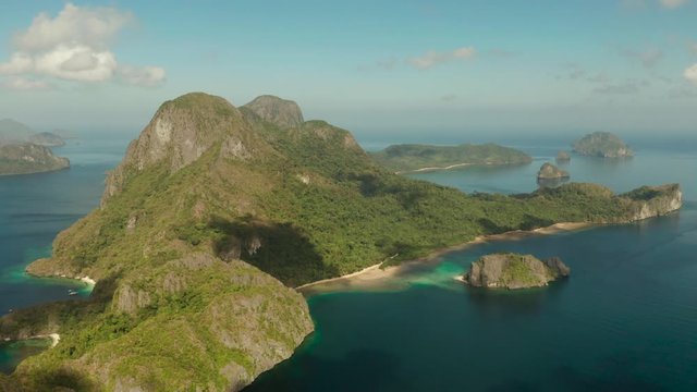 Aerial drone of Tropical landscape with islands in the blue sea, El nido. Seascape with coves and islands. Tropical Mountain Range