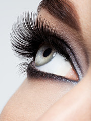 Naklejka premium woman's eye with black eye makeup. Macro style image