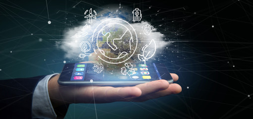 Businessman holding a World globe surronding by ecology icons and connection 3d rendering