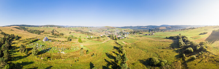 Fototapeta na wymiar Panoramic landscape. Aerial drone view of Matkiv village in Carpathians, Ukraine