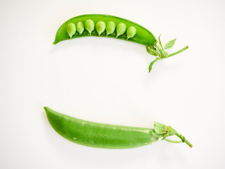 green pea pod on white background