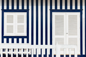 Street with colorful houses in Costa Nova, Aveiro, Portugal. Street with striped houses, Costa...
