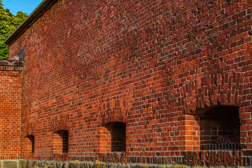 Fort brick wall in the rays of the setting sun