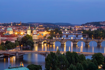 Fototapeta na wymiar Scenic view of the Old Town pier architecture and Charles Bridge over Vltava river in Prague, Czech Republic. Prague iconic Charles Bridge (Karluv Most) and Old Town Bridge Tower at sunset, Czechia.