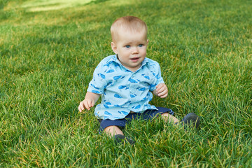 child boy on grass in park