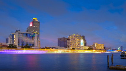 View of Bangkok buildings, Bangkok city downtown, Boat traffic on the Chao Phraya River, bangkok thailand.