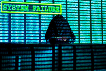 Man in hood and mask is hacking password. Programmer is writing code on multiple screens to steal...