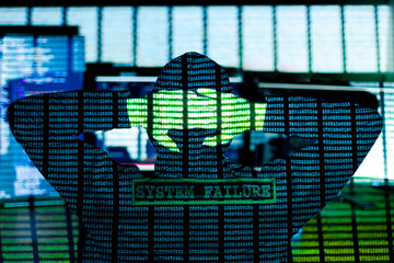Back view of man in hood is hacking password. Programmer is writing code on multiple screens to...