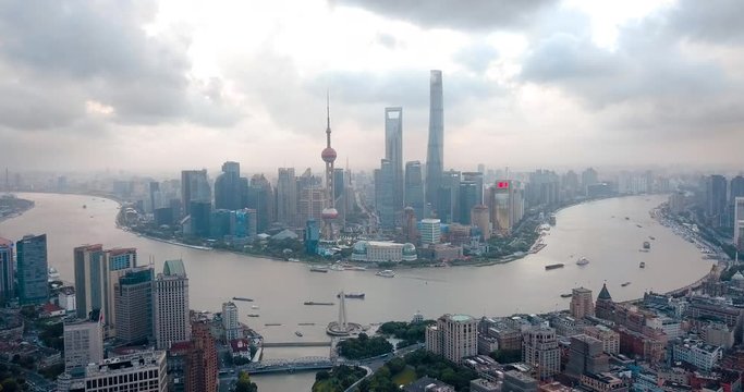 Shanghai skyline aerial footage with amazing skyscrapers rising above Haungpu river cityscape in China