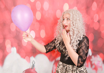 pretty christmas girl in black lace dress with purple air balloon