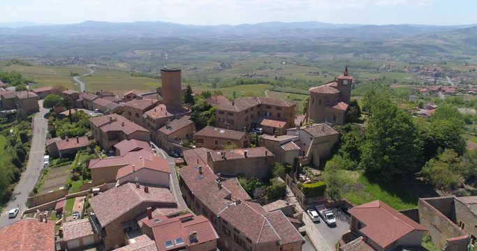 Oingt aerial lateral flight, Beaujolais, labelled Les Plus Beaux Villages de France