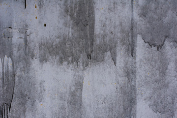 Texture of vintage rusty gray iron wall background with many layers of paint and rust