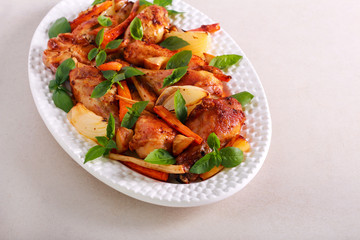 Roast chicken drumsticks with vegetables