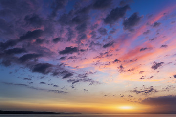 Beautiful sunset or sunrise above the sea. Tropical sunset or sunrise over sea. Colourful sunset or sunrise over water.