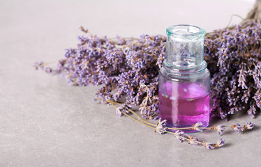 Obraz na płótnie Canvas Essential lavender oil in a bottle