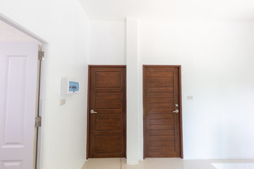 Modern brown teak door with satinless knob lock