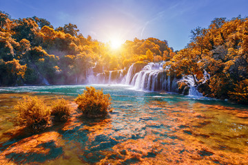 Krka national park with autumn colors of trees, famous travel destination in Dalmatia of Croatia. Krka waterfalls in the Krka National Park in autumn, Croatia.