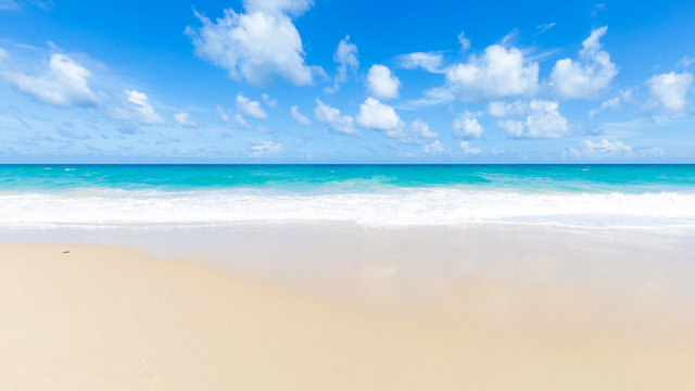 Tropical sea beach white wave against blue sky cloud