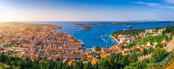 Panorama view at amazing archipelago in front of town Hvar, Croatia. Harbor of old Adriatic island town Hvar. Amazing Hvar city on Hvar island, Croatia. High resolution photo of Hvar town, Croatia. - obrazy, fototapety, plakaty