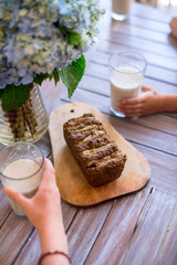 Vegan banana bread with green buckwheat and glass oat milk.
