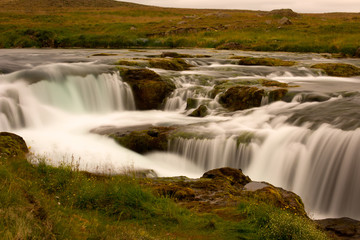 Long exposure photo of waterfall, view of the beautiful waterfall in nothern Iceland, Europe.
