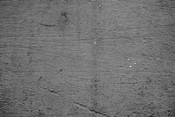 Texture of a concrete wall with cracks and scratches which can be used as a background