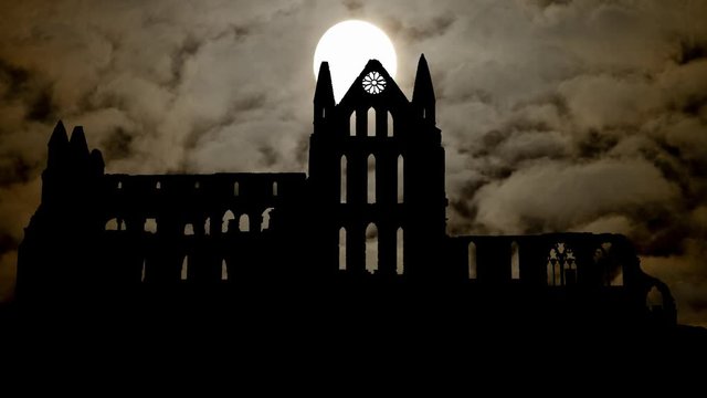 Whitby Abbey: Time Lapse by Night with Full Moon and Dark Sky, Ruined Gothic Church which Inspired the Novel Dracula, Yorkshire, England, UK