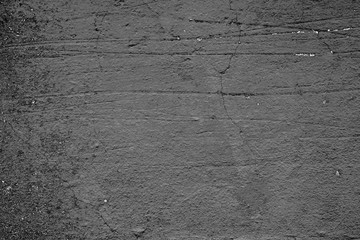 Texture of a concrete wall with cracks and scratches which can be used as a background