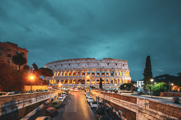 Fototapeta na wymiar Rome, Italy. Colosseum Also Known As Flavian Amphitheatre In Evening Or Night Time