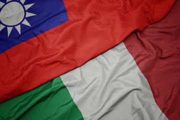 waving colorful flag of italy and national flag of taiwan.