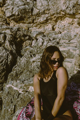 Portrait of young hipster woman with sunglasses enjoying summer. Autumn is approaching with good temperatures. autumnal beach.