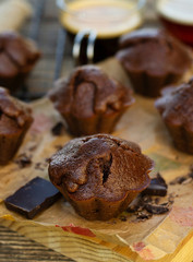 Sweet homemade chocolate muffins with chocolate served with coffee