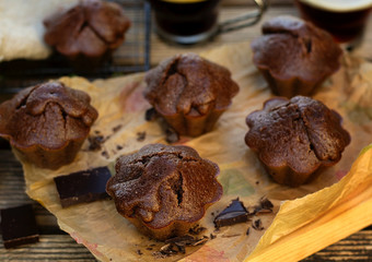 Sweet homemade chocolate muffins with chocolate served with coffee