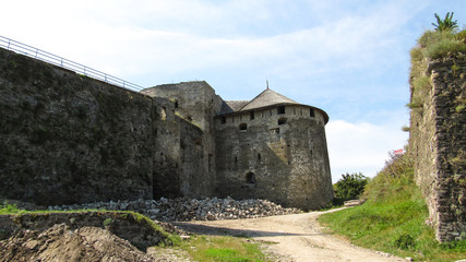 Fototapeta na wymiar High walls and towers of Kamianets-Podilskyi castle(is a former Ruthenian-Lithuanian castle and a later three-part Polish fortress located in the city of Kamianets-Podilskyi, Ukraine. 07.08.2019