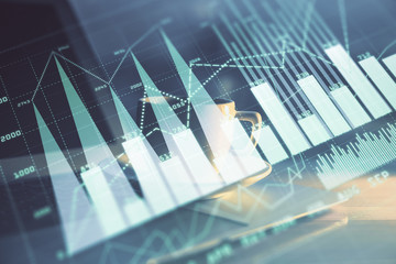 Forex Chart hologram on table with computer background. Multi exposure. Concept of financial markets.