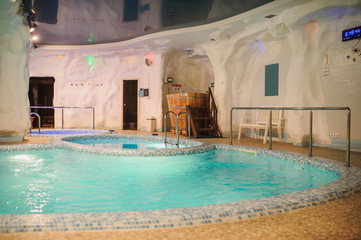 Obraz na płótnie Canvas the interior of the aquazone in a spa salon: swimming pool and a janapese tube