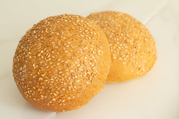 bun with sesame seeds isolated on white background