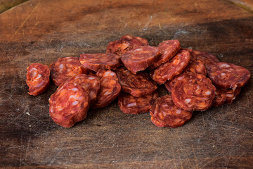 Sliced Raw Sausage Salami on Wooden Cutting Board Ready to Eat/ Closeup still life food photography