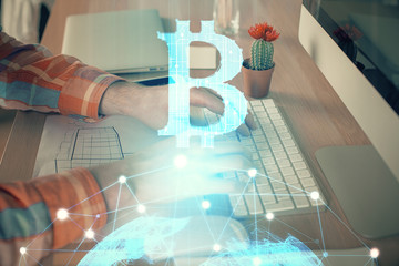 Blockchain theme hud with man working on computer on background. Concept of crypto chain. Double...