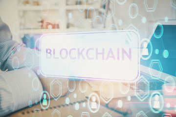 Blockchain theme hud with man working on computer on background. Concept of crypto chain. Double...