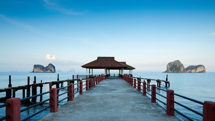 Pier on island with pavilion and bridge into the sea
