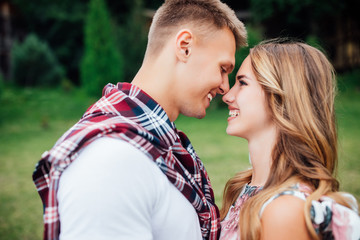 Portrait of two happiness people, couple looking to each other outside. Summer weekend together.